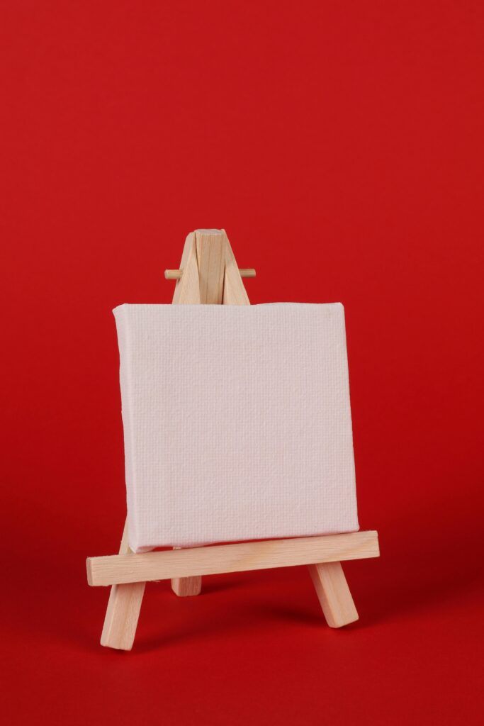 Photo of Blank Canvas Against Red Background